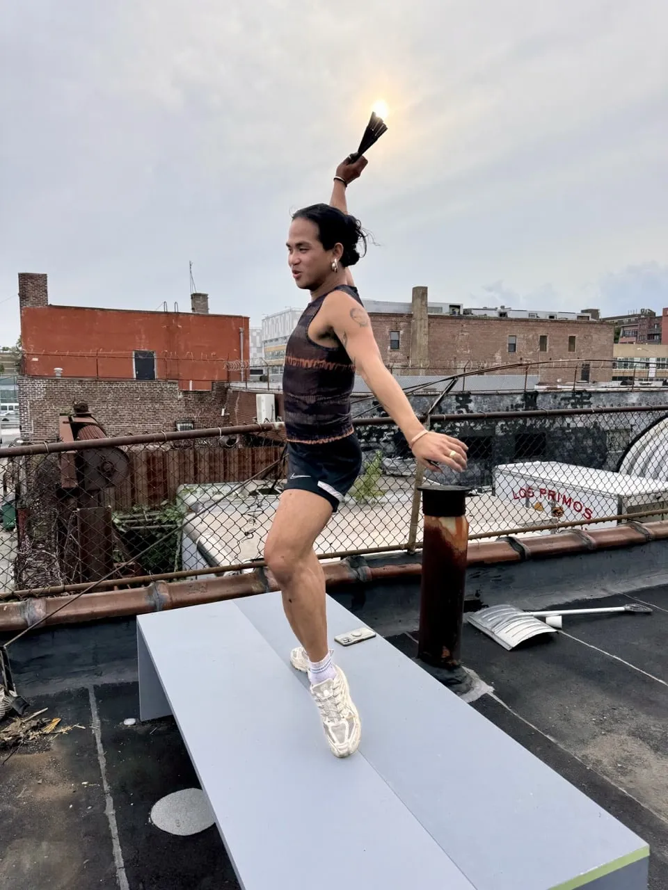 joshua serafin preparing for his performance at amant. the performance began with a secret entrance on the telos.haus rooftop.